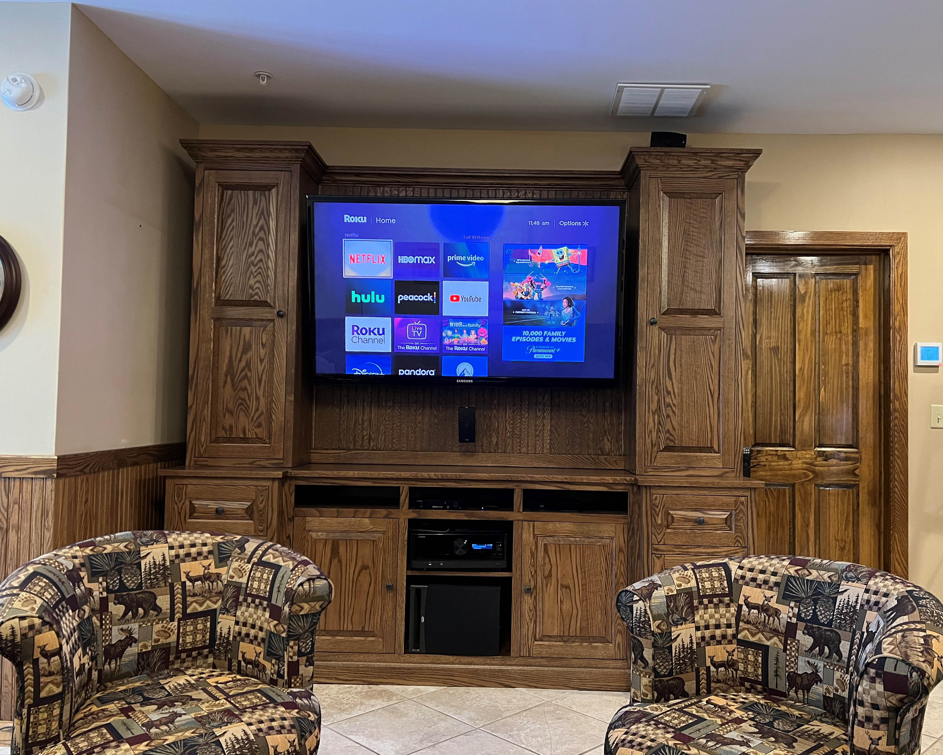 The final result is a large, custom media cabinet with plenty of storage in solid Oak wood.