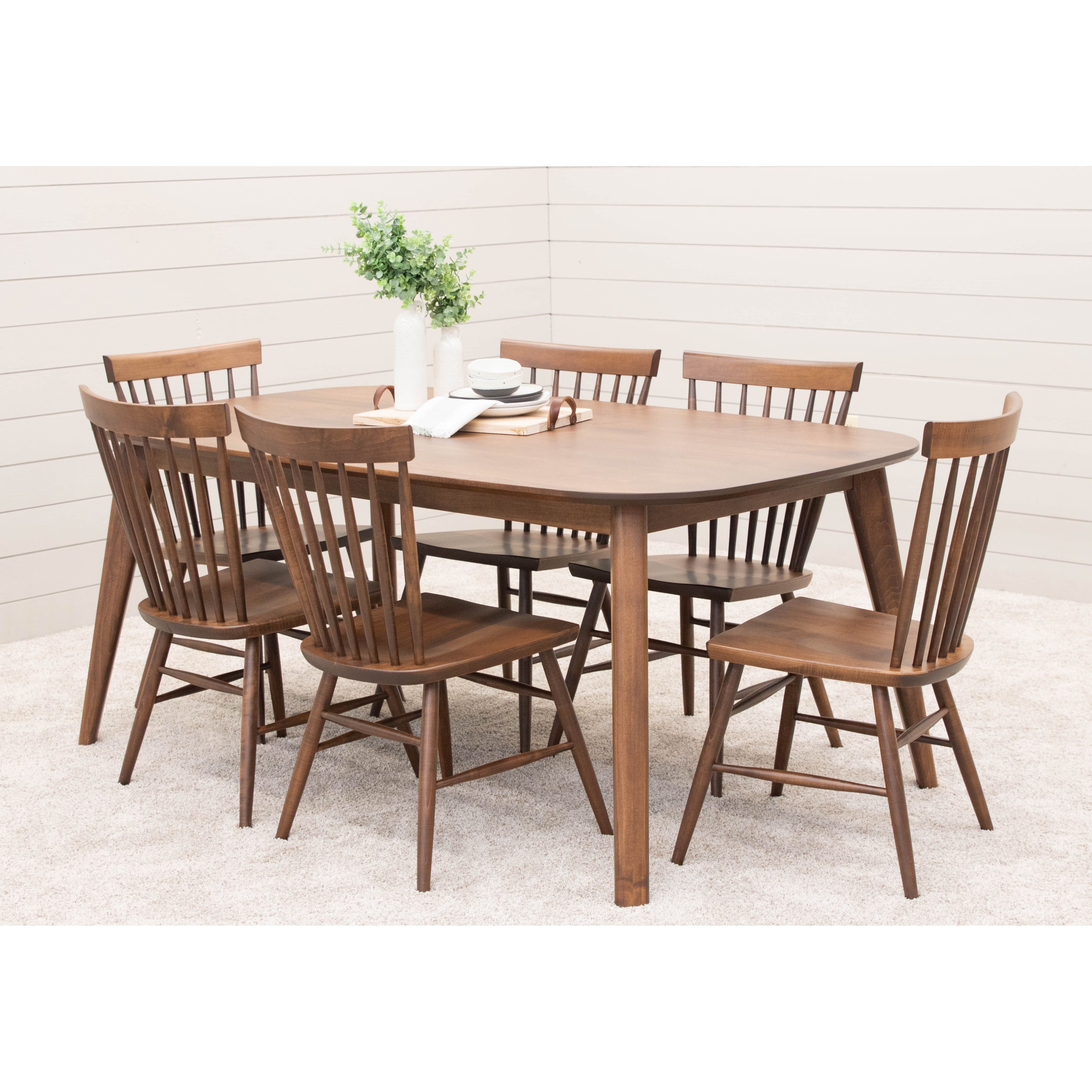 The Astoria Modern Oval Dining Table Set for 6 is shown in solid Maple wood and Winston modern wood dining chairs.
