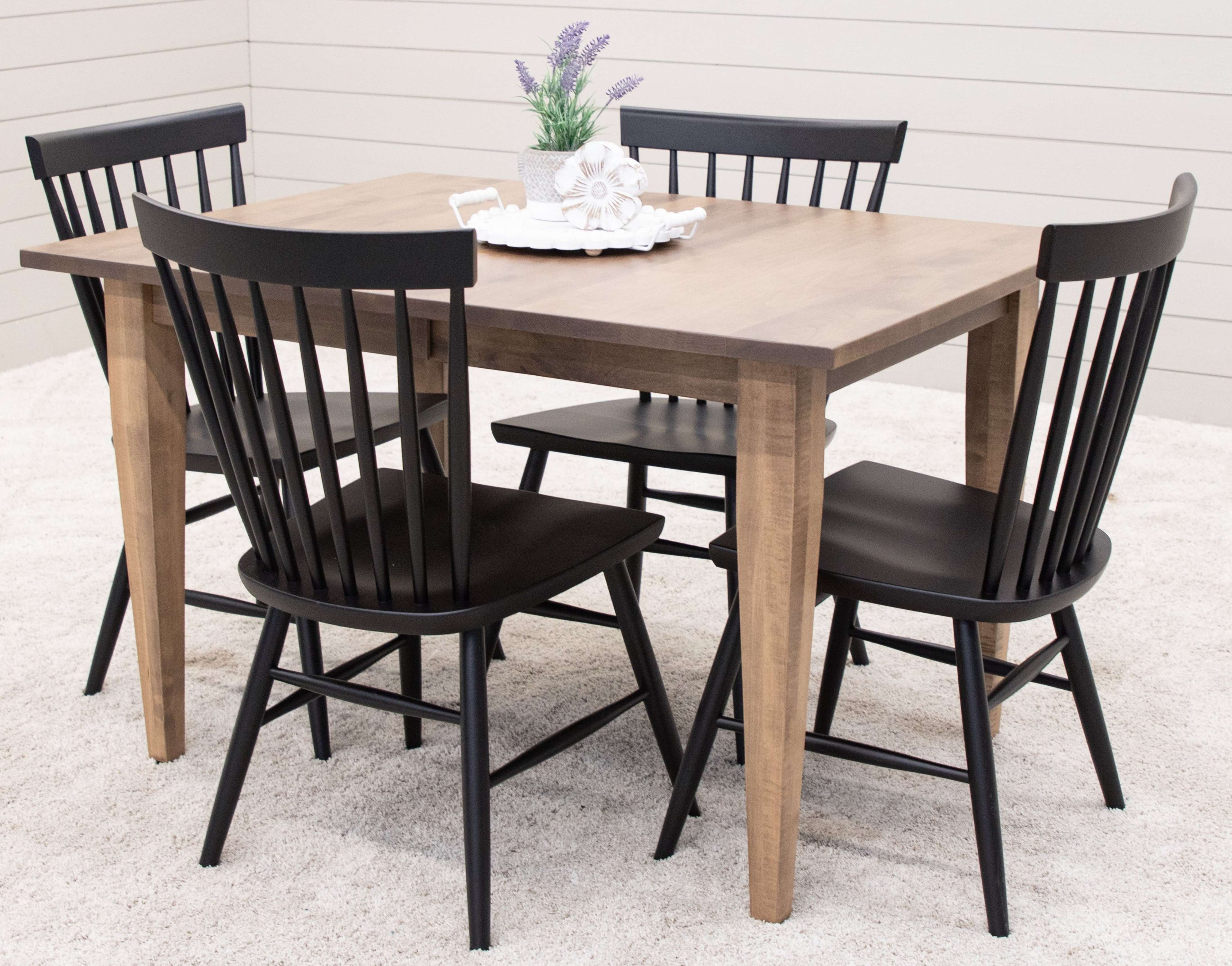 Light Maple wood dining table and 4 modern black dining chairs in solid wood