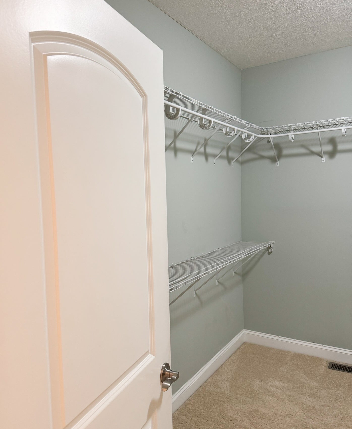 A view of the empty closet before it has been transformed with a new built in wardrobe.