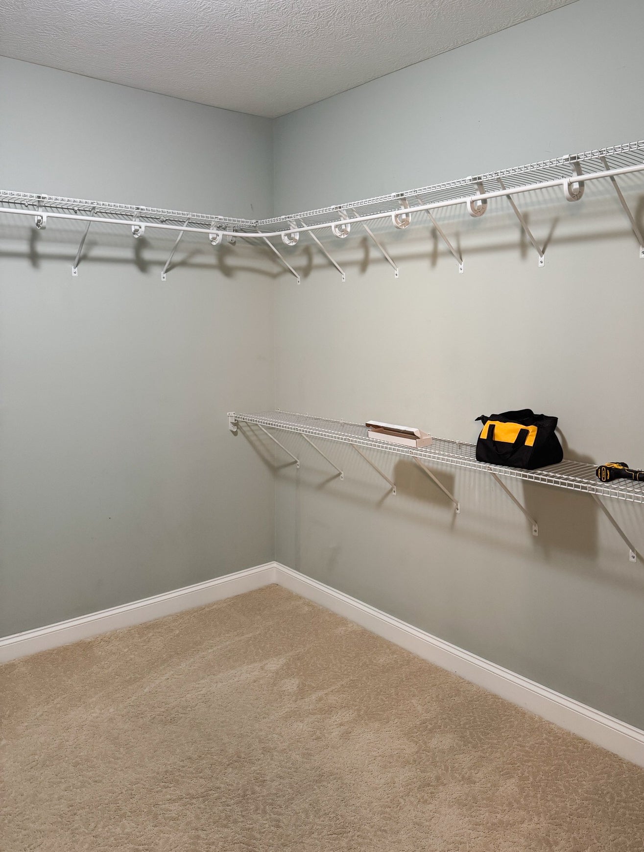 The closet photo shows empty space before a transformation.