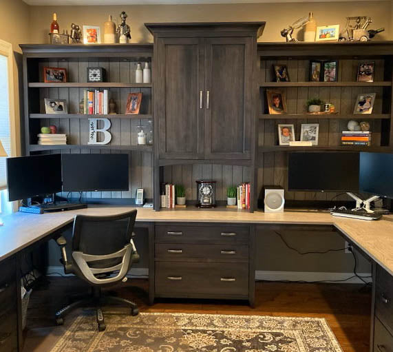 The stunning custom office spaces feature a large partner desk and open bookcases in solid Maple wood with a rich dark stain.