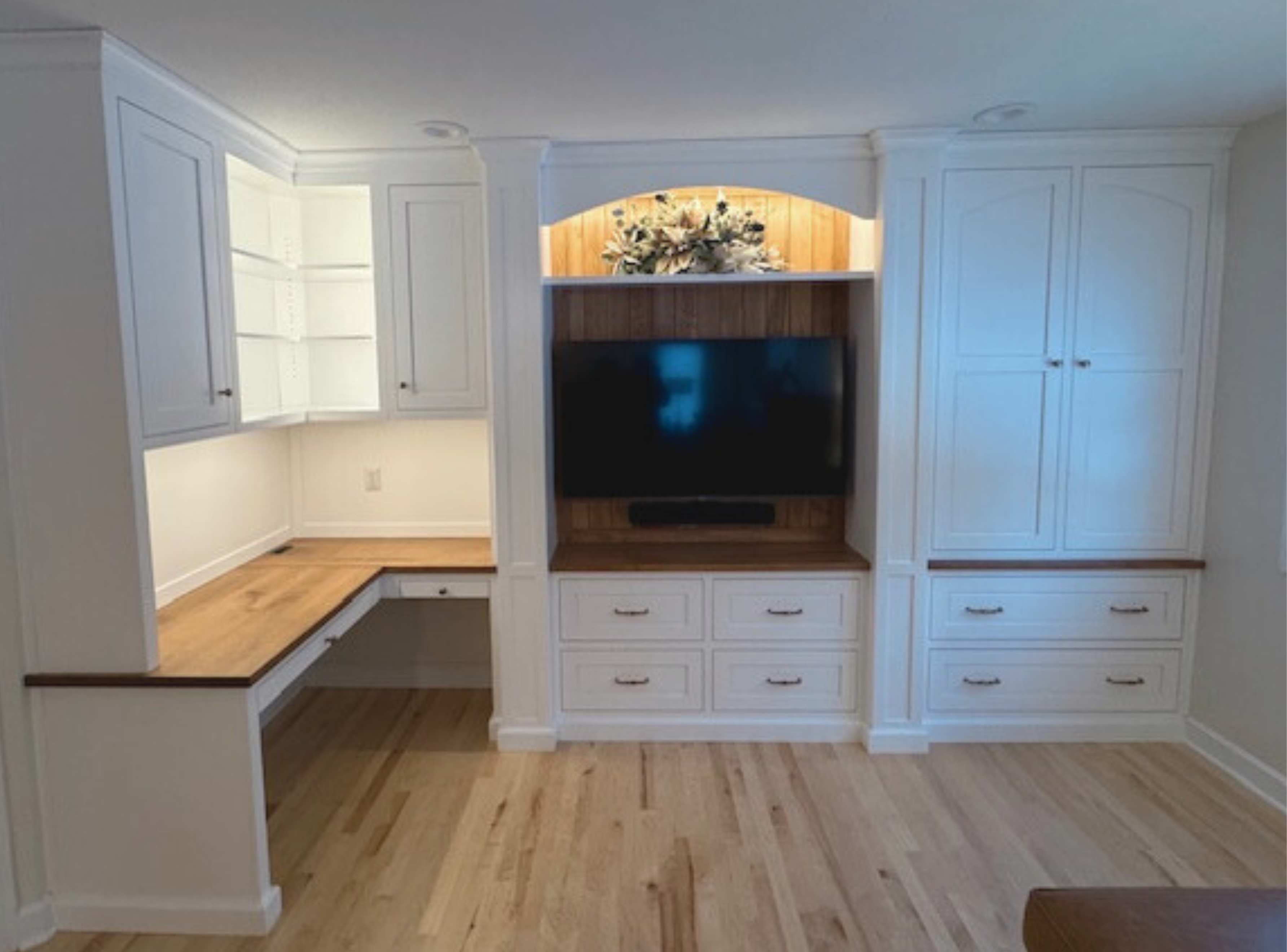 Amish Custom Built in Desk with Entertainment Center creates a focal point with solid wood white cabinets and rustic wood top on the corner desk