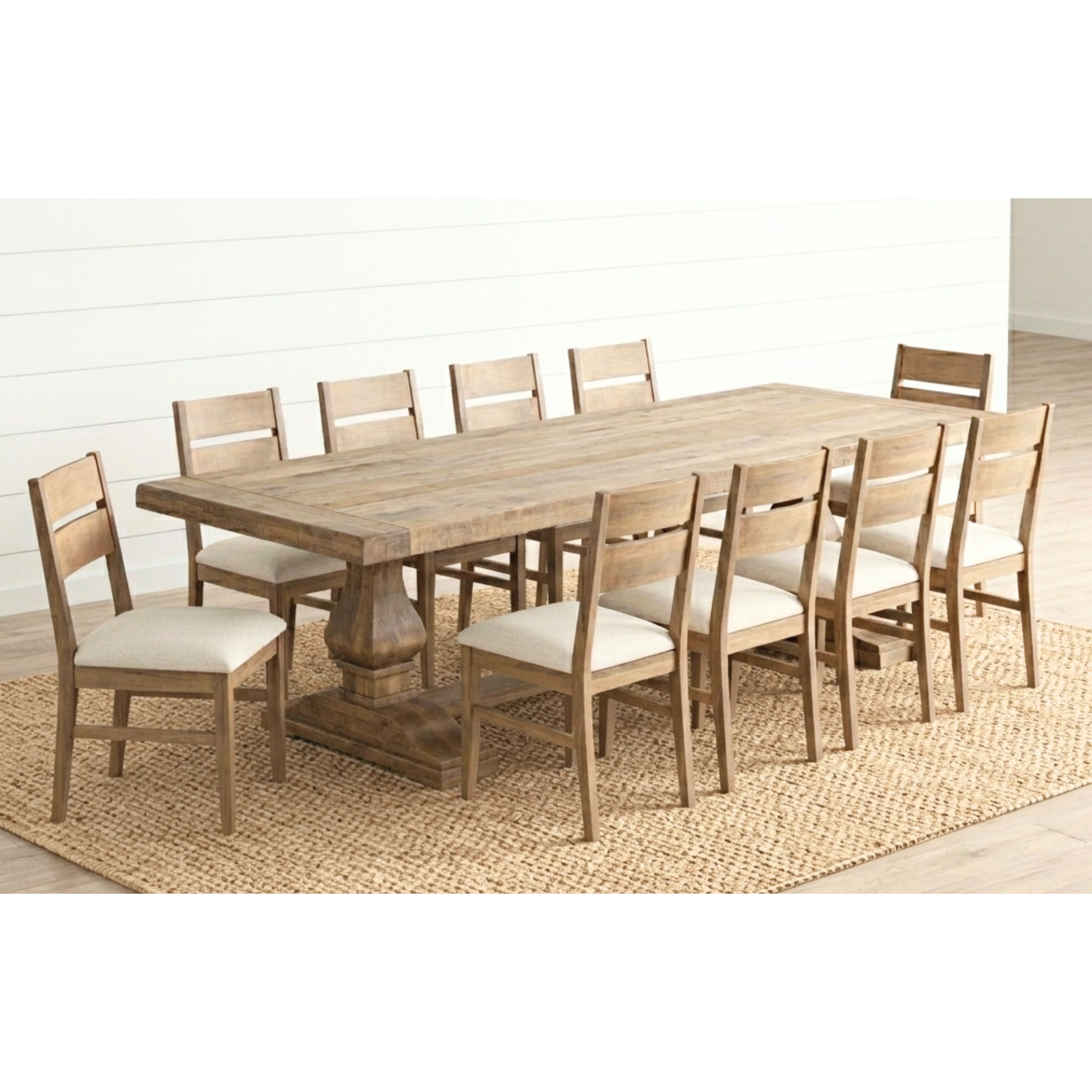 A large modern pedestal table set with 10 chairs in solid Maple wood.